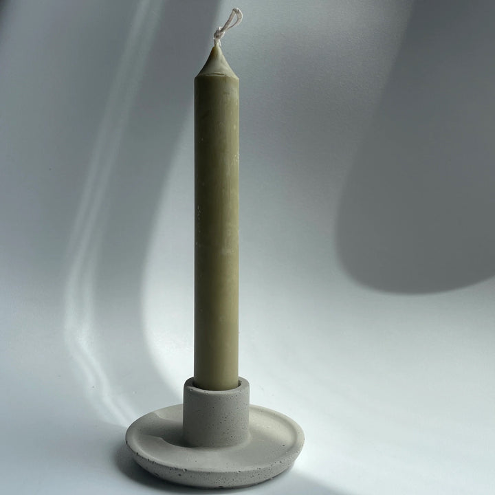 Handmade concrete candle holder with taper candle, simple style, made in Canada.