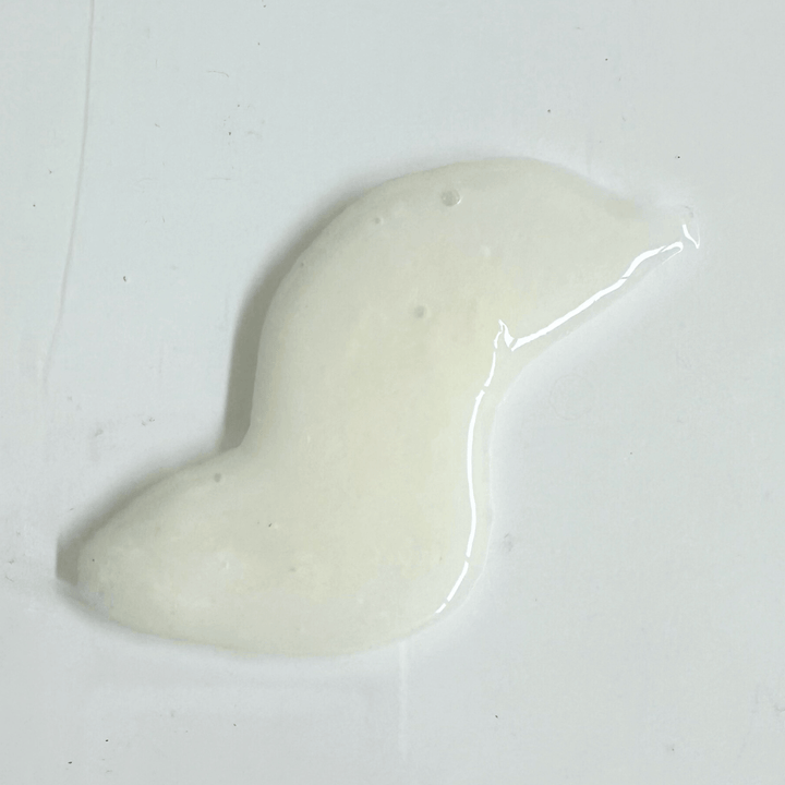 Mekabu Hydrating Shampoo texture showcasing its creamy, low-foaming formula for shiny, hydrated hair enriched with botanical nutrients.