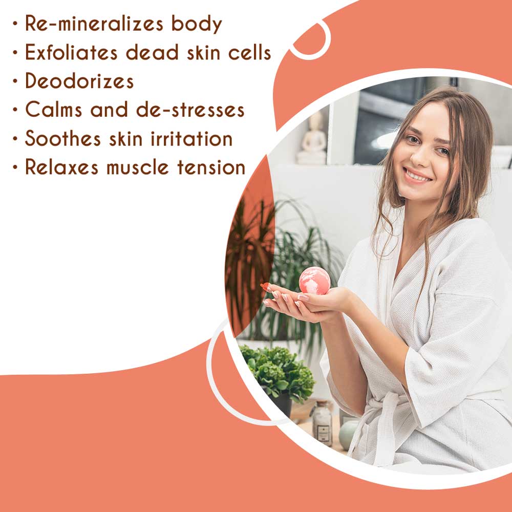 Woman holding Himalayan pink salt bath ball, benefits include calming, deodorizing, exfoliating, soothing skin, and relaxing muscles.