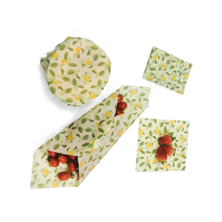 Set of 3 beeswax reusable food wraps in assorted sizes with colorful fruit design, eco-friendly alternative to plastic wrap