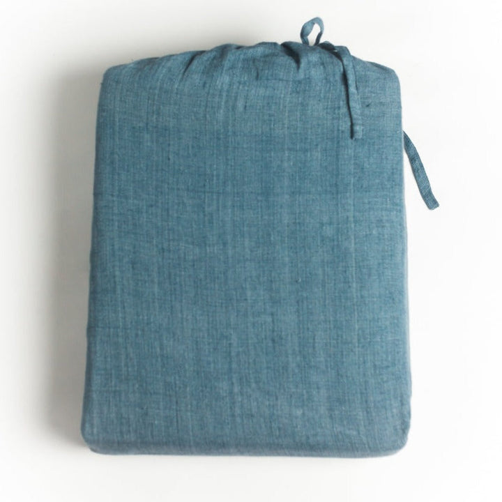 Denim blue linen duvet cover set made from Belgian flax, showcasing temperature-regulating, moisture-wicking fabric.