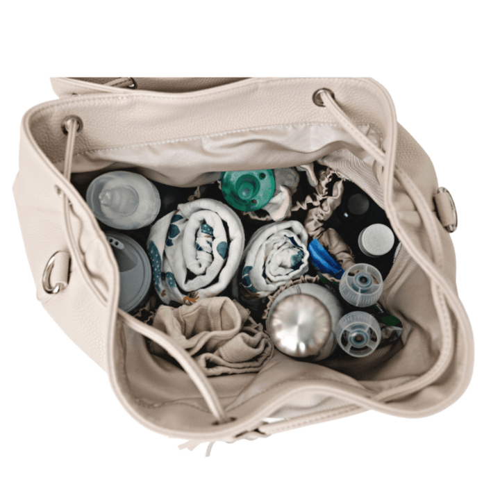 Interior of Citi Journey Vegan Leather Diaper Bag - Pearl, showcasing organized baby essentials and spacious design