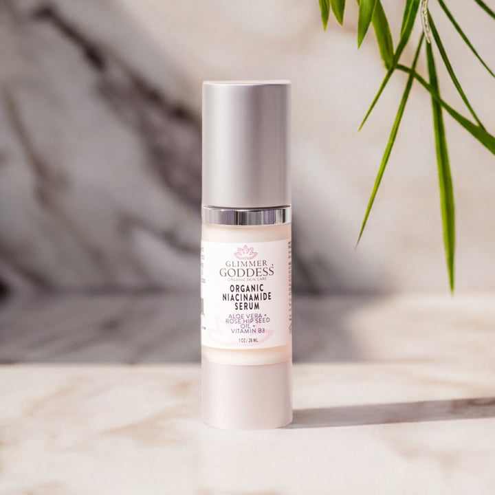 Organic Niacinamide Anti Aging Serum bottle with natural ingredients like Rosehip Seed Oil and Shea Butter for glowing skin.