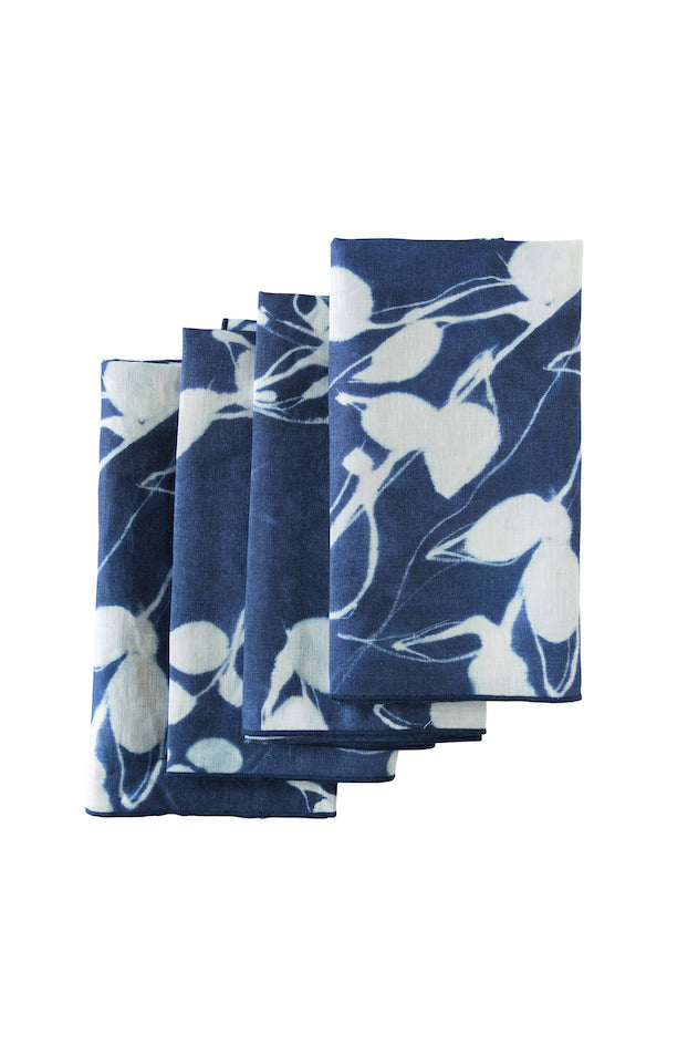 Indigo blue linen dinner napkins with abstract floral print inspired by Portuguese landscapes on white background