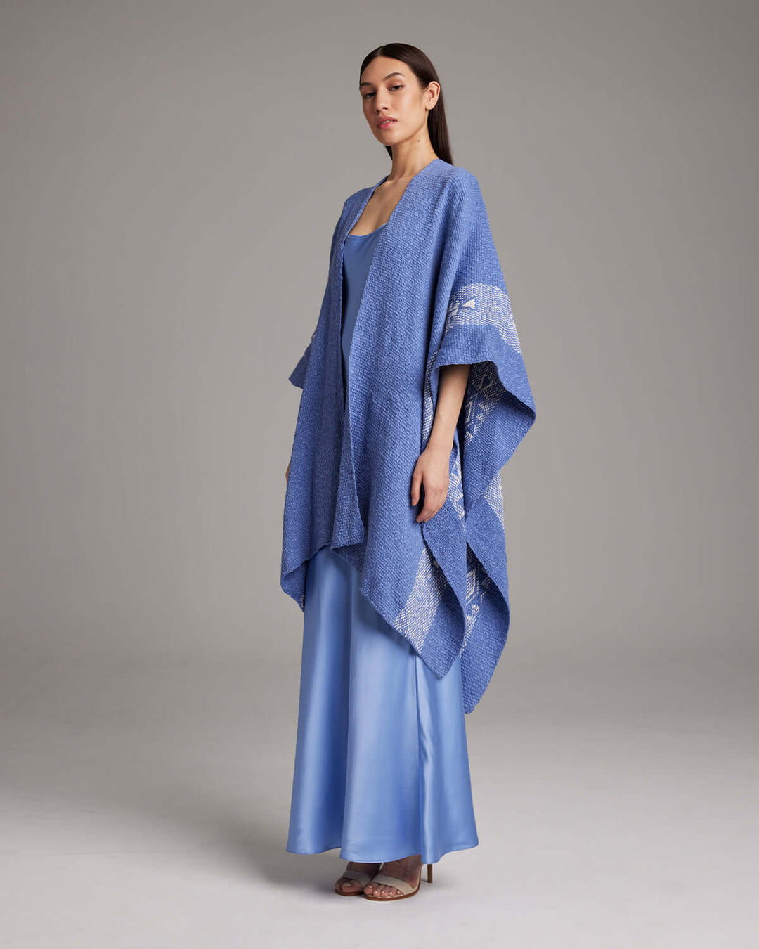 Model wearing Long Estrella Textured Cotton Duster in Periwinkle/Ivory, featuring Estrella symbol, handmade in Chile by Mapuche artisans.