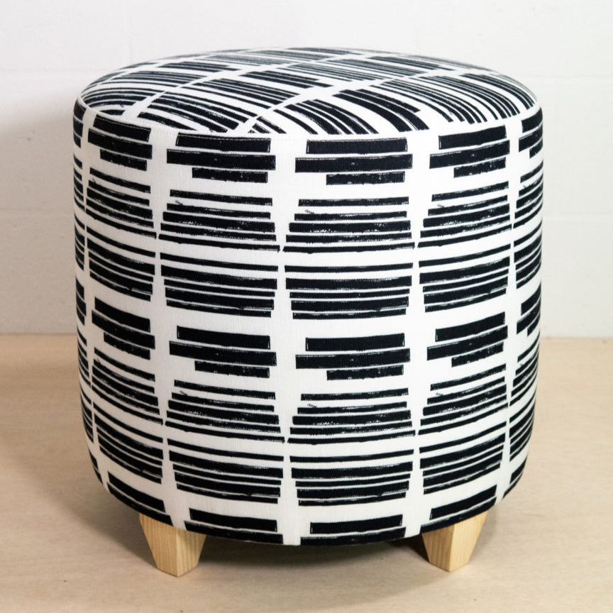 Marguerite round ottoman in the Clairvoyant print