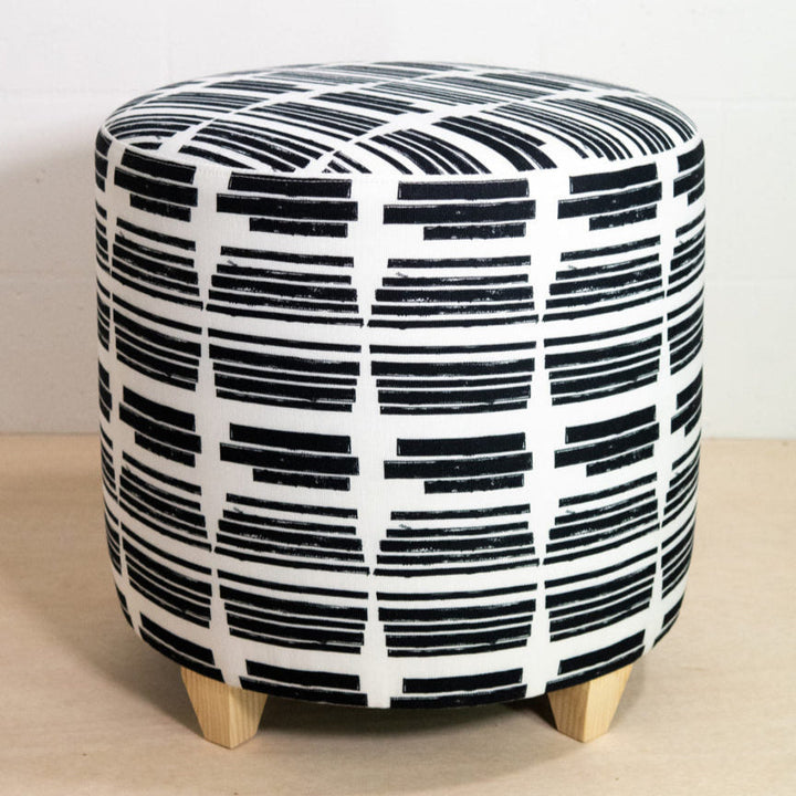 Marguerite round ottoman in the Clairvoyant print