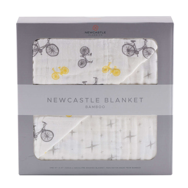 Vintage bicycle and northern star bamboo muslin blanket in soft natural tones for babies and children