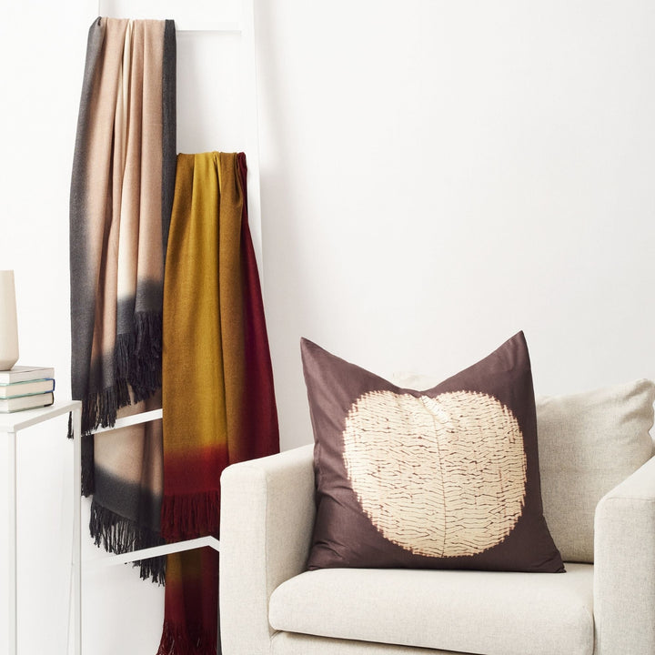 Black and white shibori pattern mulberry silk pillow with natural dye resist technique handcrafted by Indian artisans