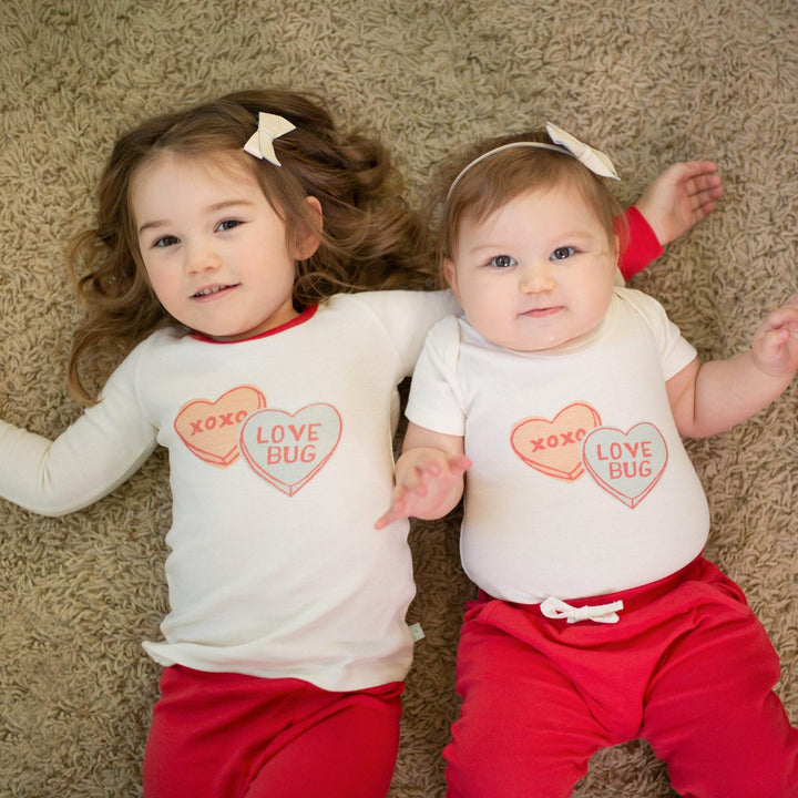 Organic cotton toddler pajamas with candy heart print in soft natural fabric with elastic waistband