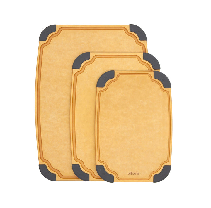 Three wooden cutting boards in graduated sizes with non-slip feet and juice grooves stacked for kitchen storage