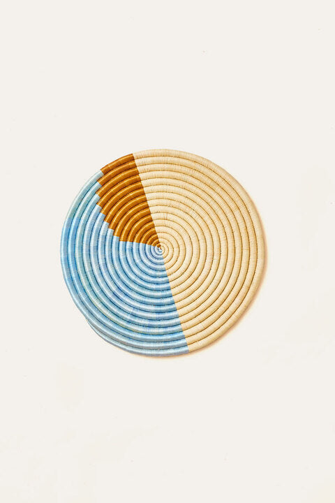Handwoven sisal and sweetgrass wall platter in light blue bronze and natural tones from Rwanda artisan
