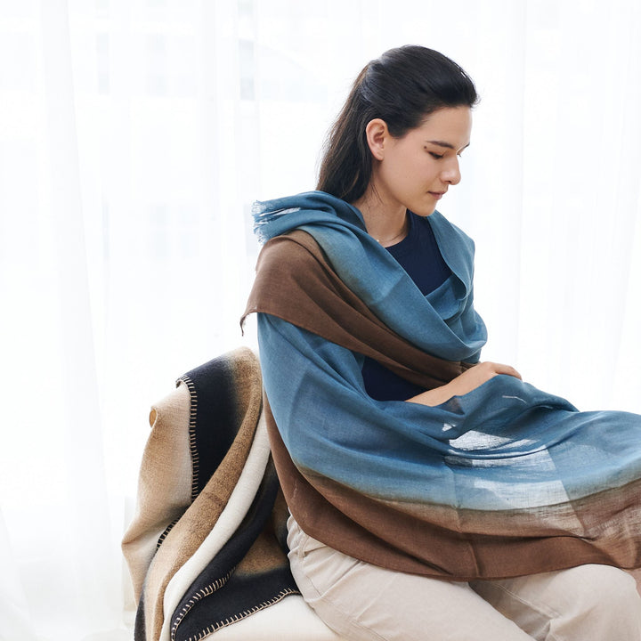 Handwoven linen silk scarf in mahogany brown and blue ombre colors displayed on neutral background