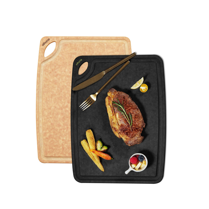 Natural and black reversible wooden cutting boards with deep grooves and thumb holes for kitchen meal prep