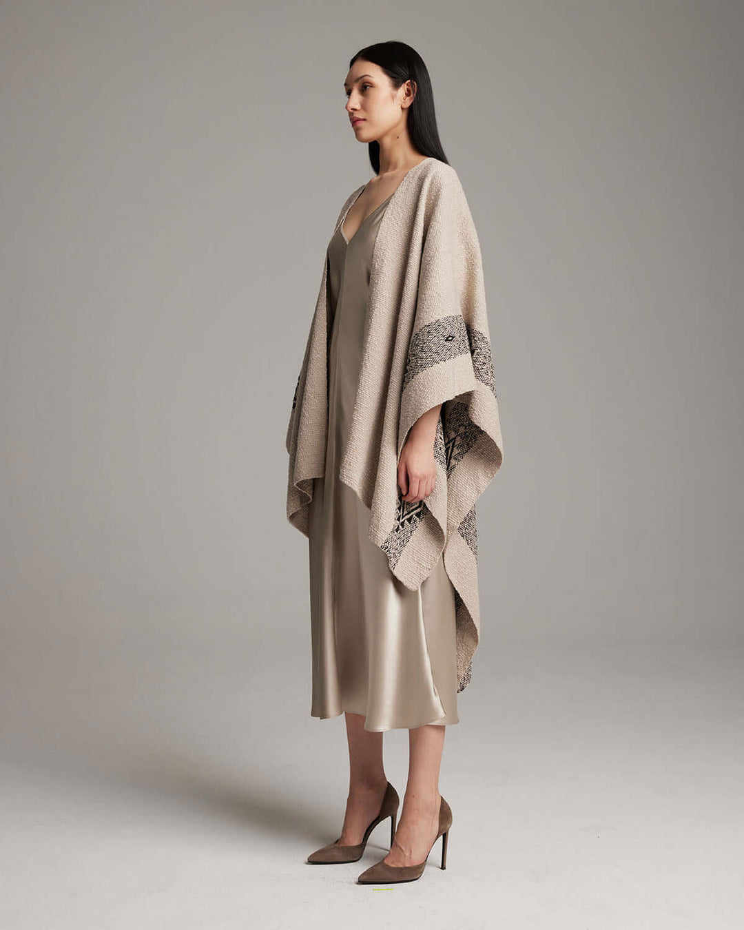 Model wearing Long Estrella Textured Cotton Duster, handmade in Chile from organic pima cotton with Estrella symbol, side view.