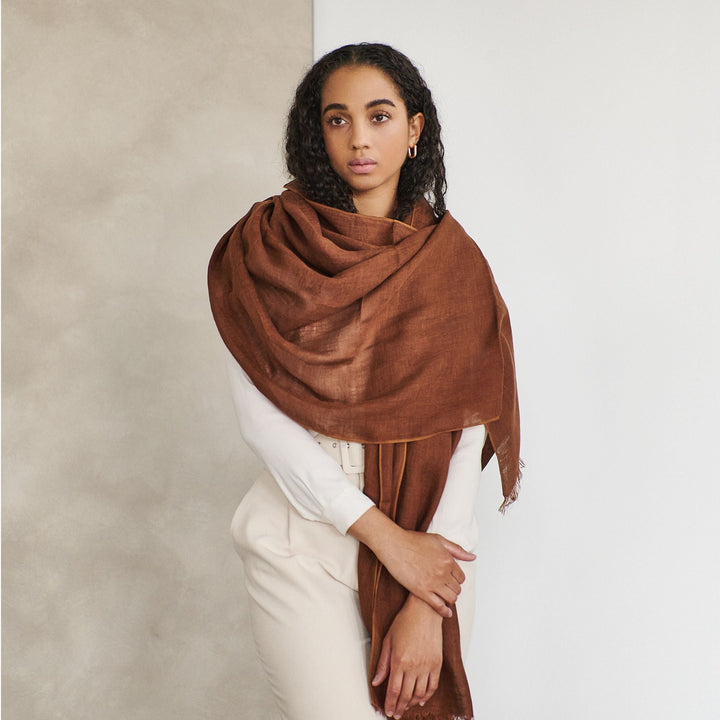 Coco brown hand woven linen silk scarf with natural translucent texture draped elegantly
