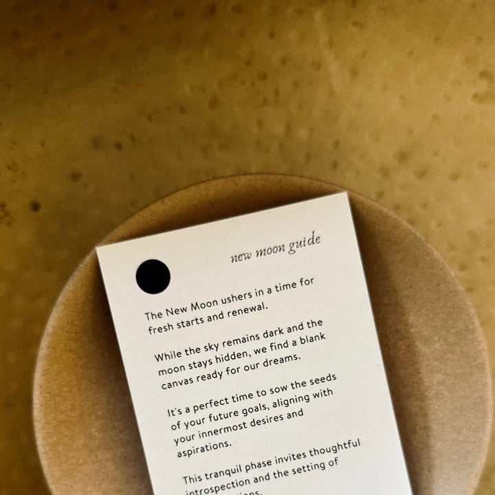Close-up of the New Moon guide card from the Lunar Reflections Mindfulness Deck, focusing on fresh starts and renewal themes.