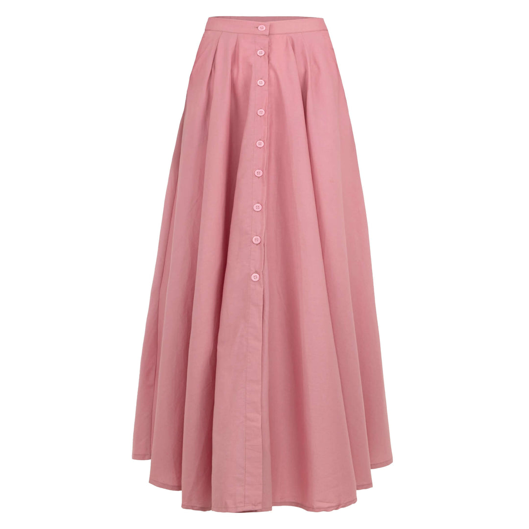 Blush pink Arum Pleated Maxi Skirt with smocked waist, buttons, and pockets, designed in Bali for a soft and feminine look.