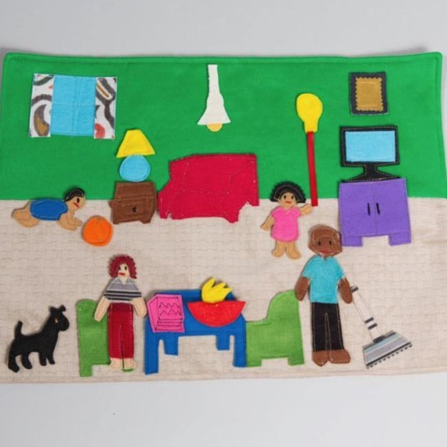 Portable family dollhouse play set with soft felt figures, furniture pieces, and rollable mat for imaginative play