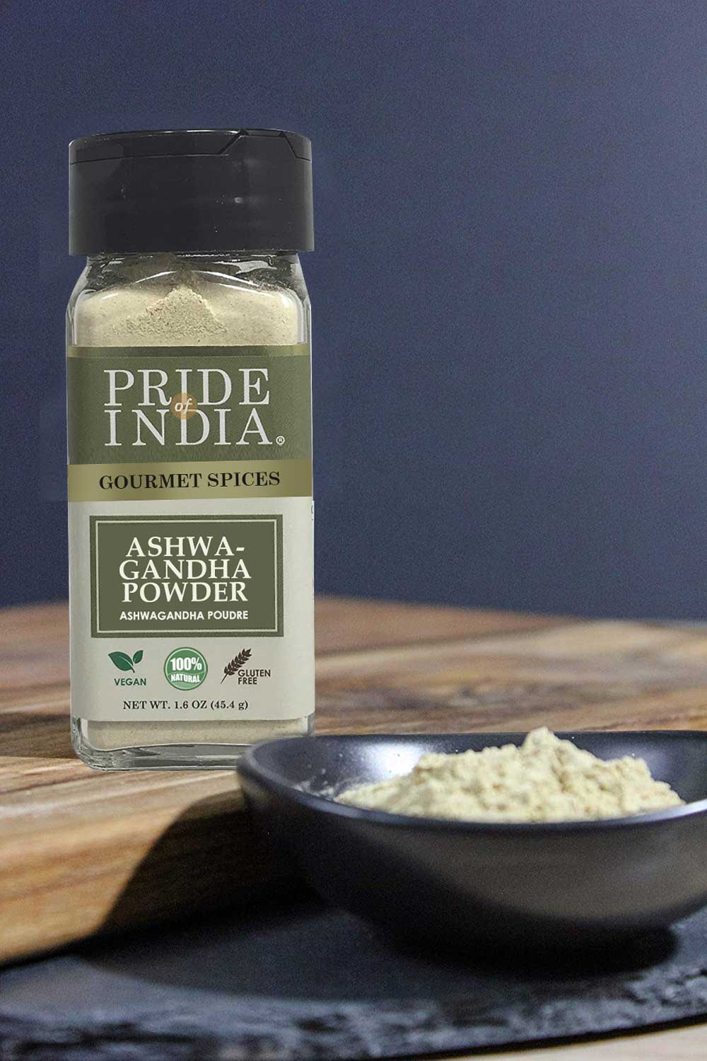 Gourmet Ashwagandha Root Powder by Pride of India on a wooden surface with a bowl of powder.