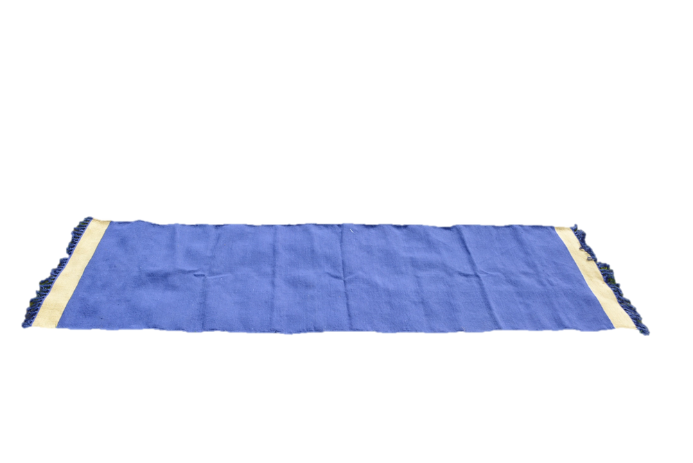 Handwoven cotton floor yoga rug with fringes in blue and beige, eco-friendly and ideal for meditation and Ashtanga yoga sessions.