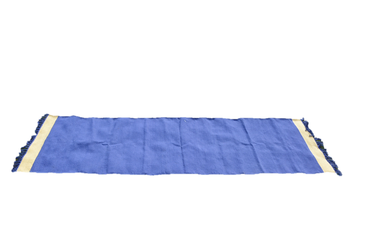 Handwoven cotton floor yoga rug with fringes in blue and beige, eco-friendly and ideal for meditation and Ashtanga yoga sessions.