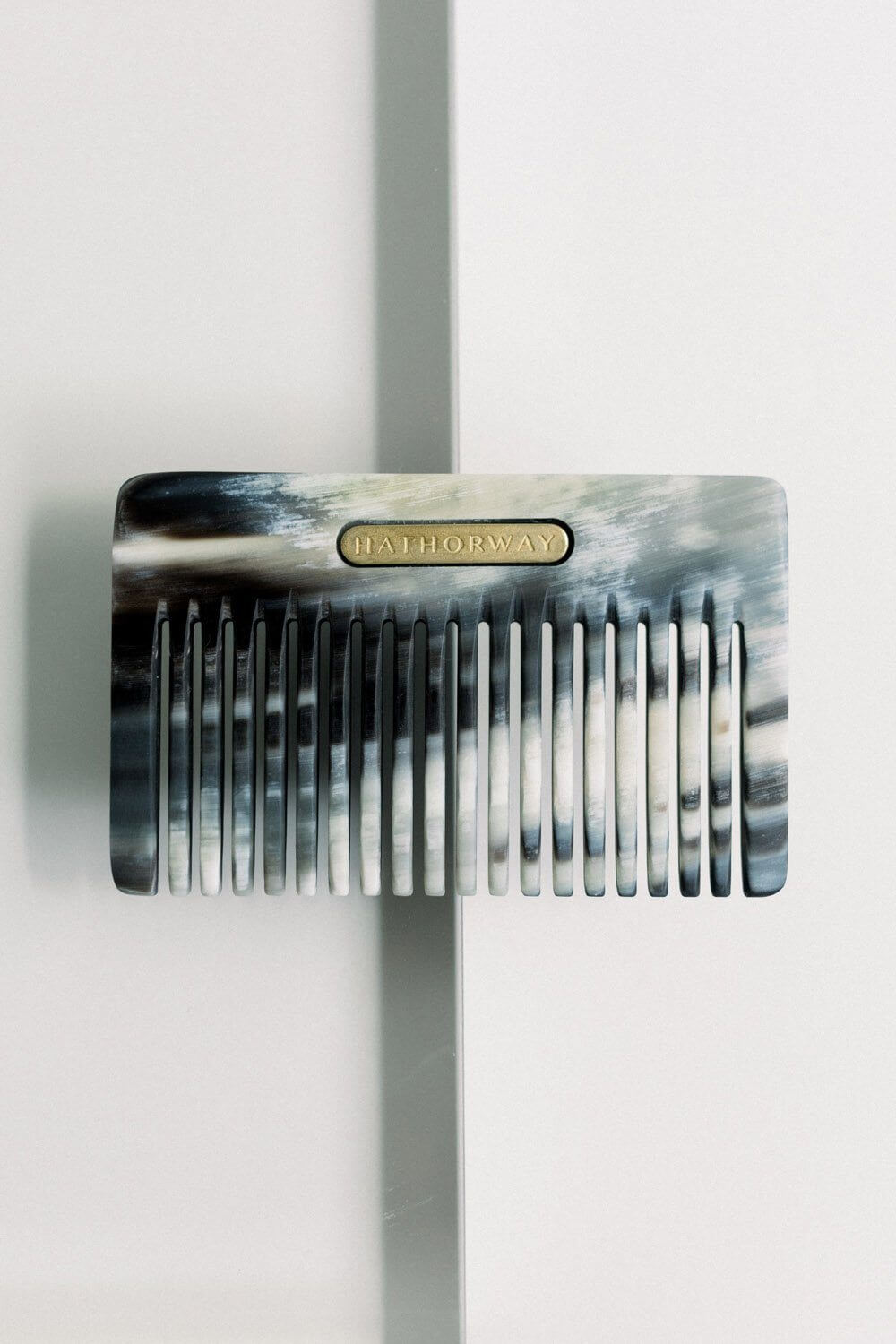 Pocket-sized Chai Buffalo Horn Comb for hair and beard by Hathorway, featuring ethically-sourced materials and stylish design.
