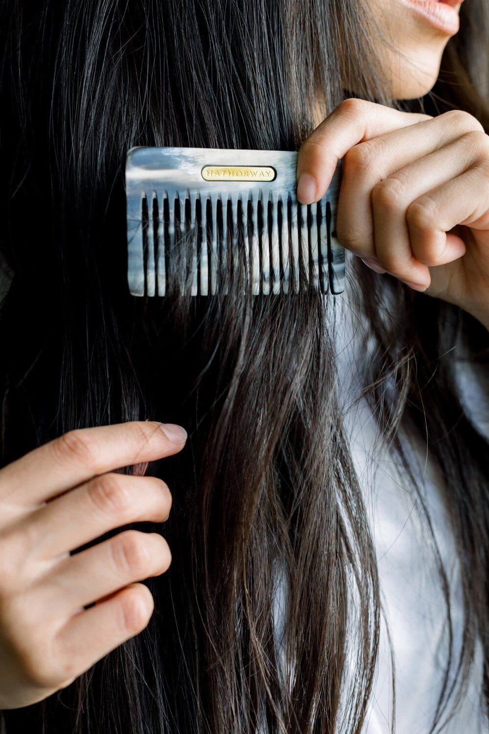Pocket-sized Chai Buffalo Horn Comb used for brushing long hair