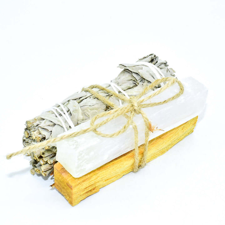 Palo Santo, crystal, and sage smudge bundle for spiritual cleansing and positive energy.