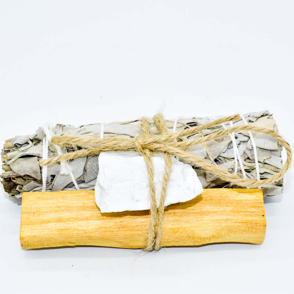 Palo Santo, crystal, and sage smudge bundle for spiritual cleansing and positive energy