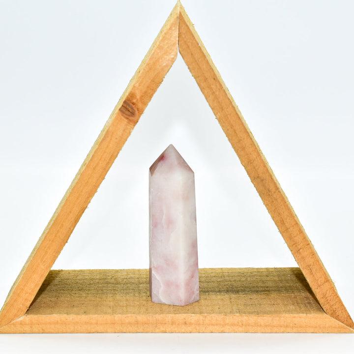 Natural pink opal crystal point for heart chakra healing and meditation, approximately 3-4 inches tall