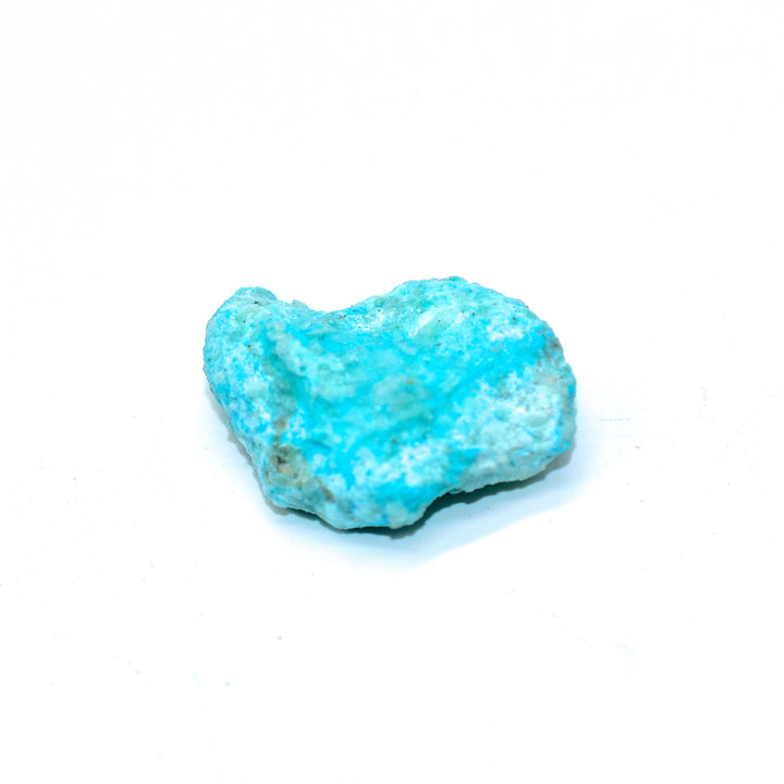 Raw Sleeping Beauty turquoise rough stones from Arizona showing natural blue color variations