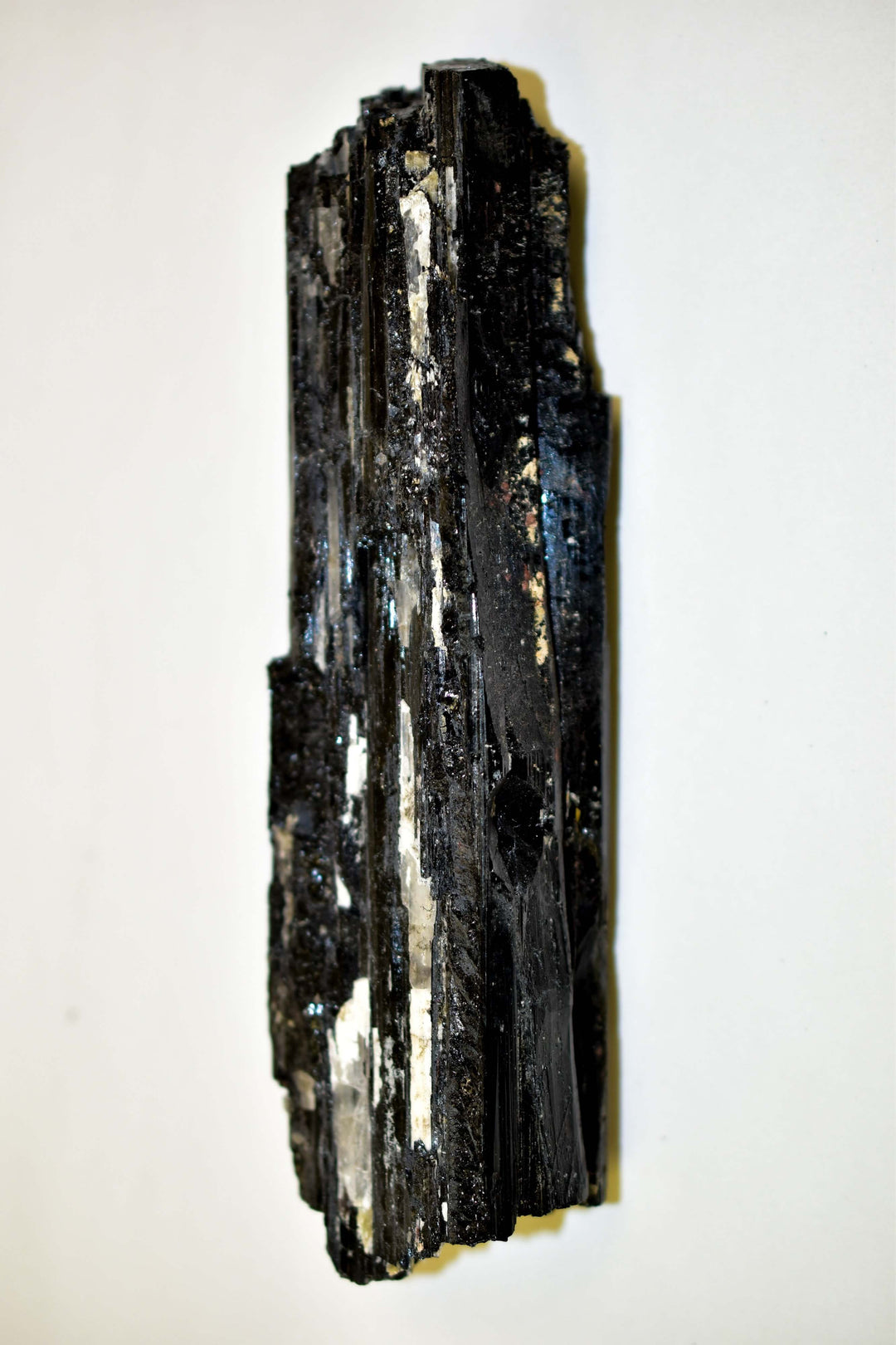 Large natural Black Tourmaline crystal chunk from Brazil, 4-6 inches long, perfect for absorbing negative energies in home or office.