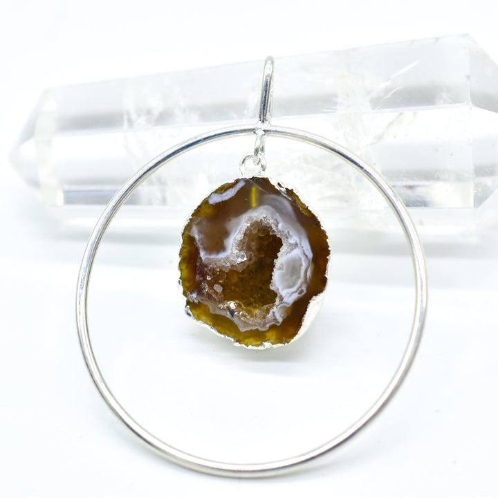 Natural agate geode with druzy crystals suspended in plated metal circle pendant necklace handmade in Brazil