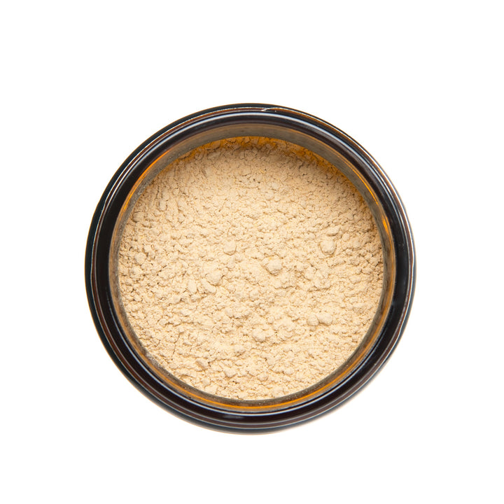 Ashwagandha powder in a black container, adaptogenic supplement for stress relief and improved concentration.