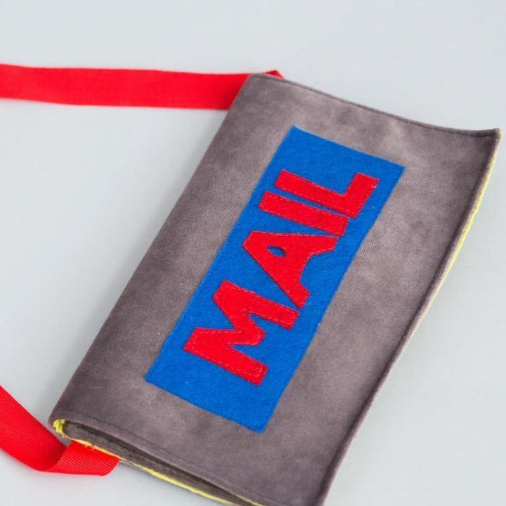 Handmade mail carrier play set with soft bag, colorful envelopes, and postcard for imaginative dramatic play