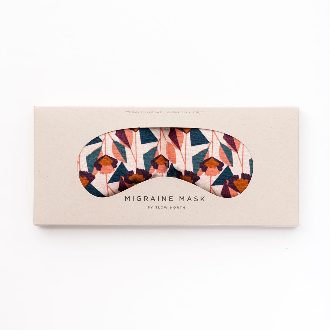 Weighted eye mask for migraine relief with colorful textural pattern, designed to ease stress and tension. Ideal for relaxation.