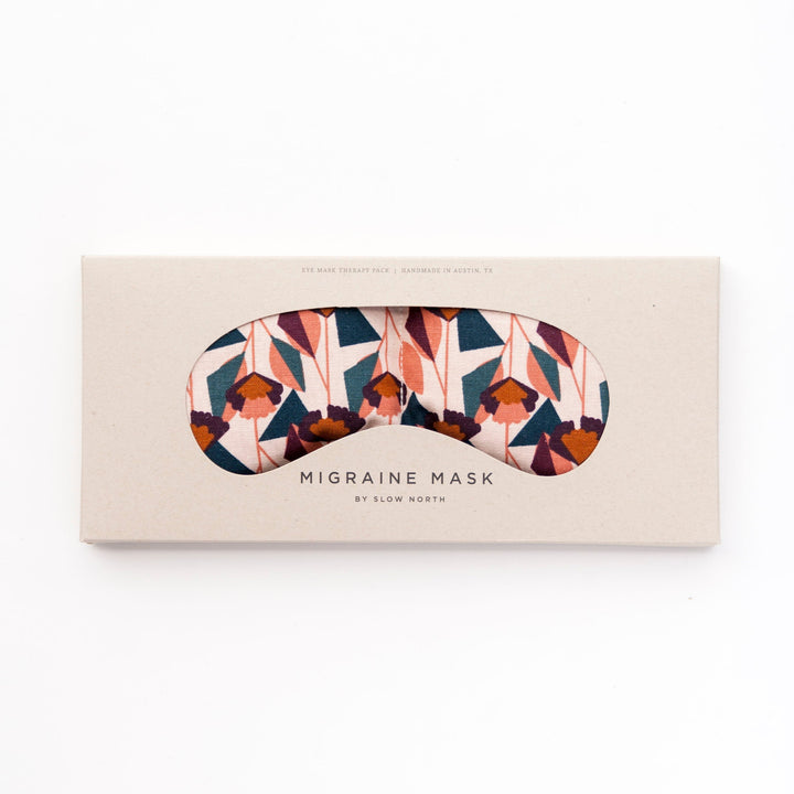Weighted eye mask for migraine relief with colorful textural pattern, designed to ease stress and tension. Ideal for relaxation.