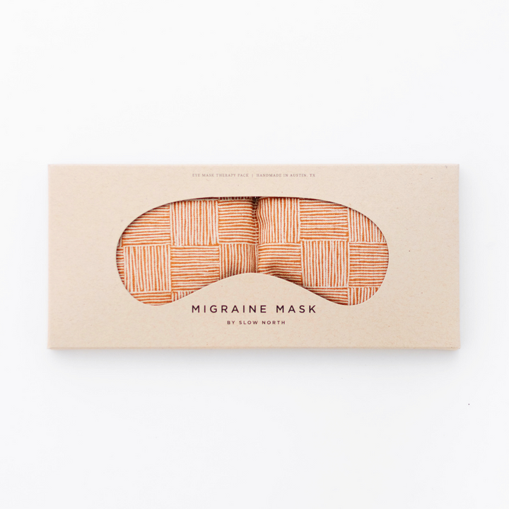 Weighted eye mask packaging with textural pattern for tension and migraine relief.