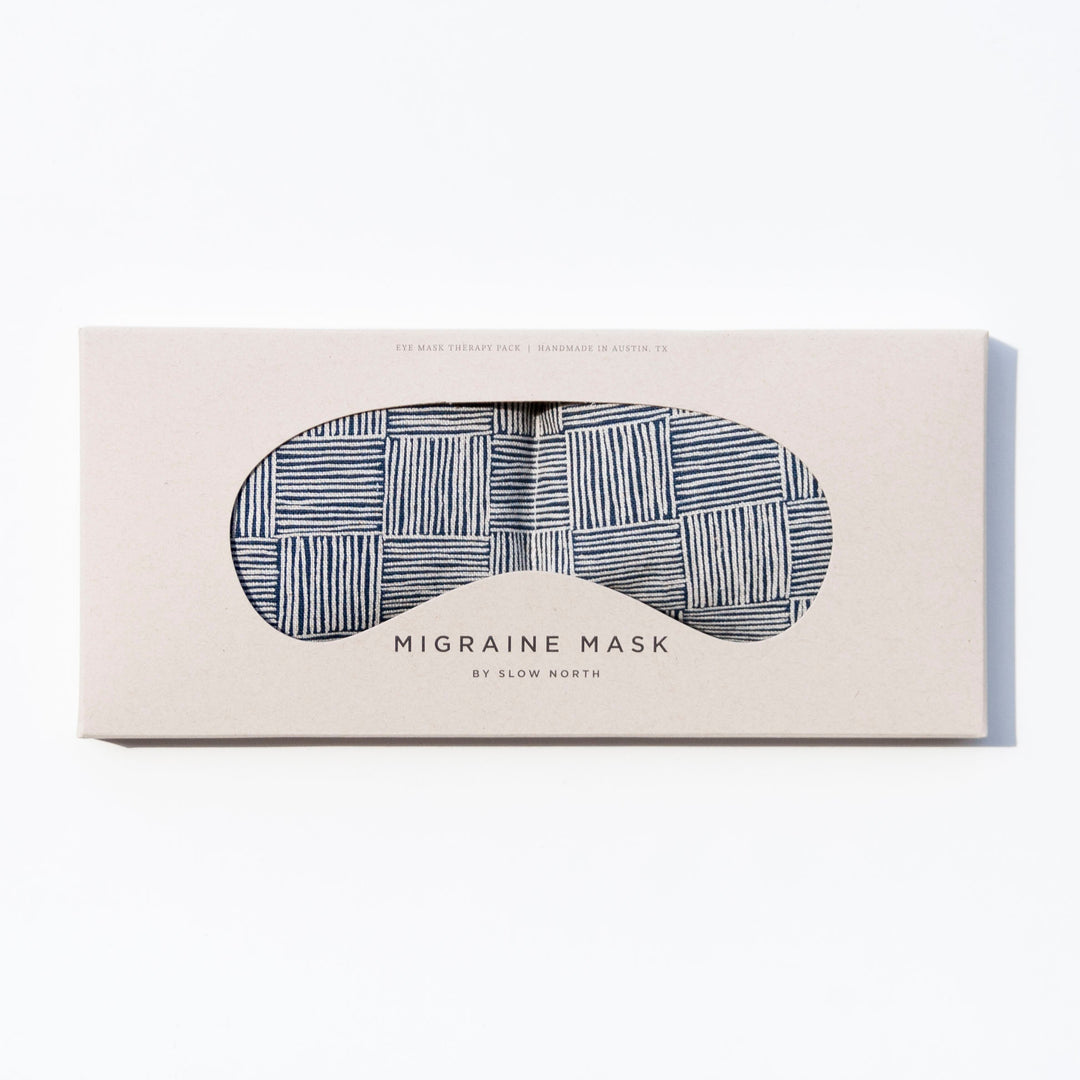 Weighted eye mask in box with striped pattern for migraine relief and tension reduction by Slow North.