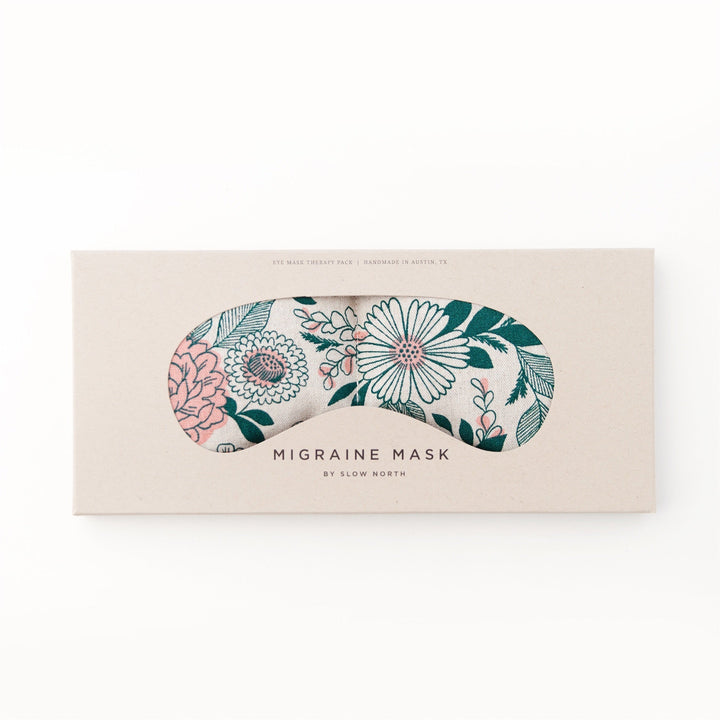 Floral patterned weighted eye mask for migraine relief, packaged with natural design by Slow North.