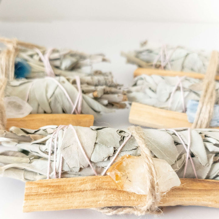 Palo Santo, crystal, and sage smudge bundle for spiritual cleansing and positive energy