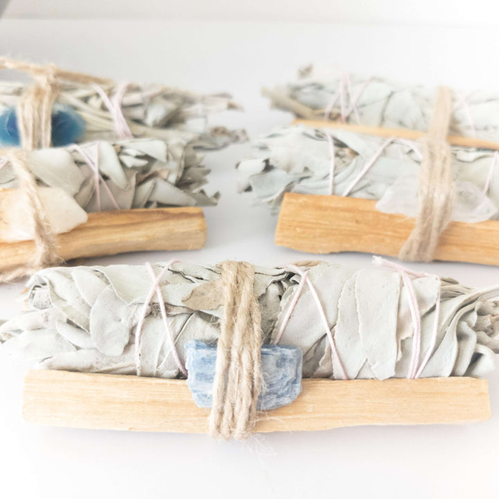Palo Santo, crystal, and sage smudge bundle for spiritual cleansing and positive energy