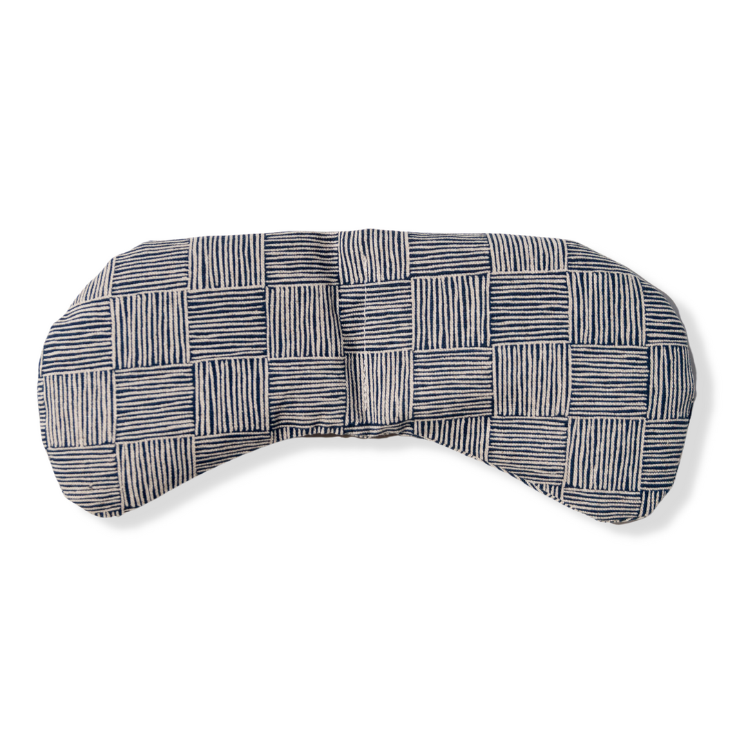 Weighted Eye Mask with a neutral textured pattern for migraine relief and stress reduction.