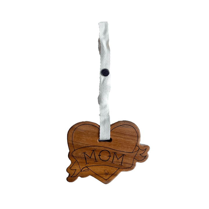 Organic cotton stroller toy with mom tattoo design hanging from baby stroller bar