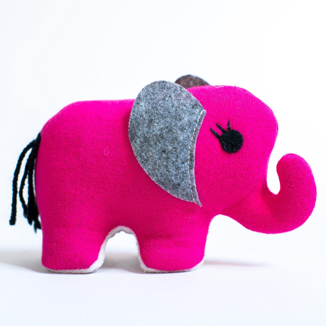Small pink handmade elephant plush toy with soft fleece and felt materials, approximately 3 inches tall