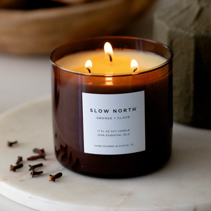 Orange clove three wick soy candle with black metal lid and essential oils for aromatherapy and larger spaces