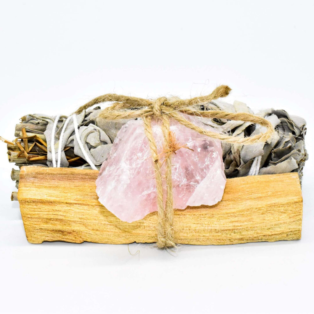 Palo Santo, crystal, and sage smudge bundle for spiritual cleansing and positive energy with choice of crystal, wrapped in twine.