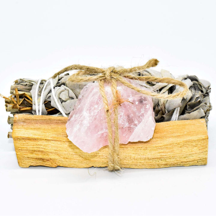 Palo Santo, crystal, and sage smudge bundle for spiritual cleansing and positive energy with choice of crystal, wrapped in twine.
