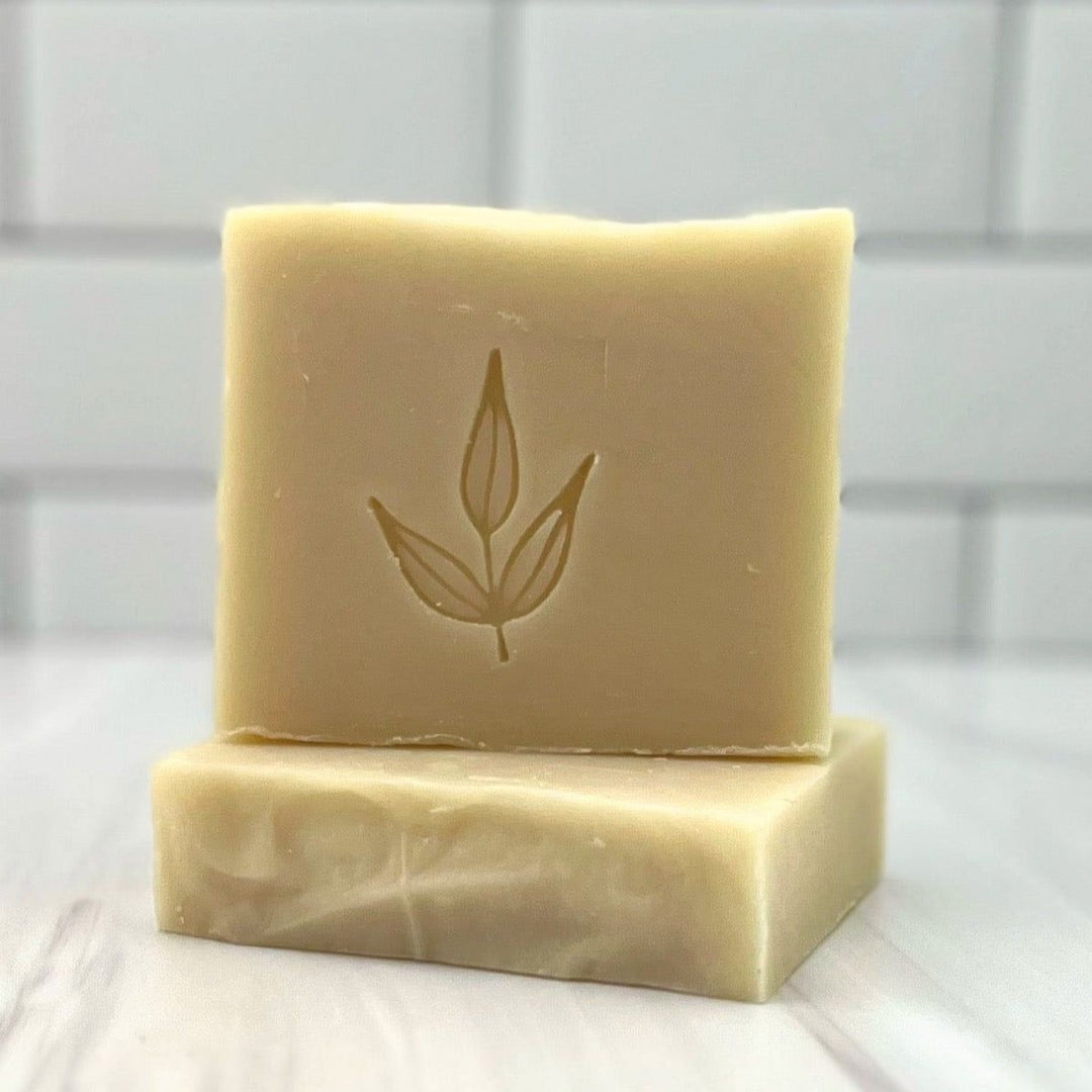 Unscented castile bar soap, palm-free, with a natural olive leaf imprint, ideal for naturalists and those seeking pure, simple skincare.